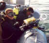 Tony Schudel and Toby entering the water with UW Metal Detectors during the salvage of the Titan IV rocket.